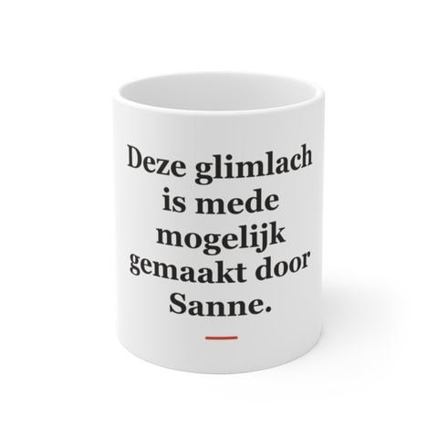 Mok met tekst “Deze glimlach is mede mogelijk gemaakt door Sanne.” — cadeau voor een tandarts